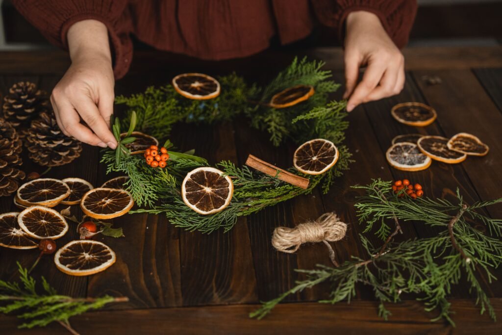 Dried orange slice and pinecone garland hanging on a Christmas tree