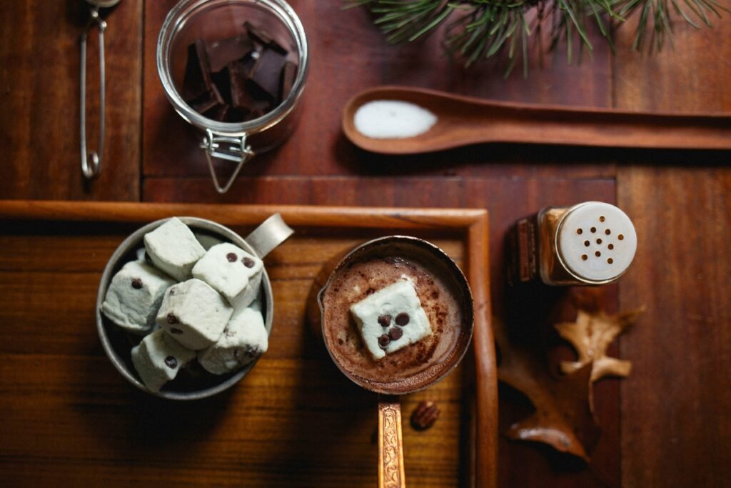 Hot cocoa gift jar with marshmallows tied with a ribbon