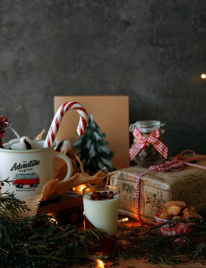 Neatly wrapped Christmas gifts with ribbon and a sprig of greenery